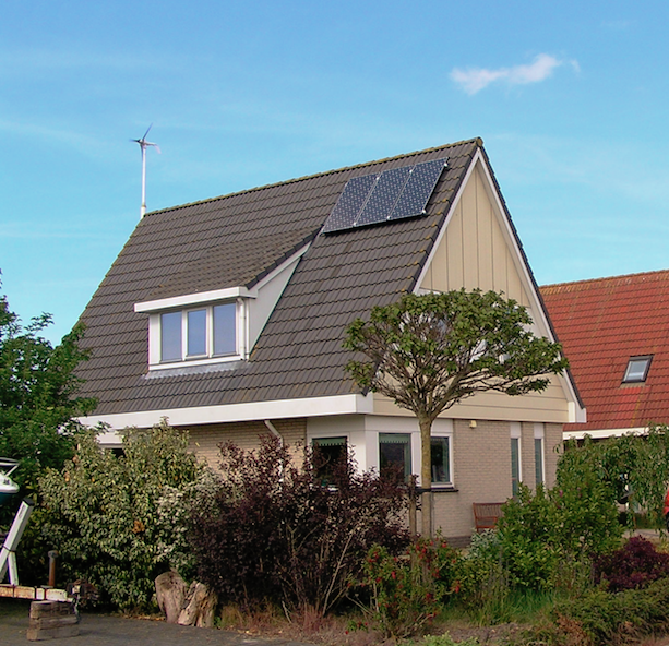 A windmill and 3 solar panels on Peter's house.