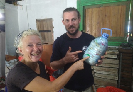 Tom shows a bottle filled with love and lots of plastic: a love bottle